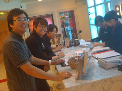 Jaz Lai, Edmund Toh and Khai Siung signing up at Red Box